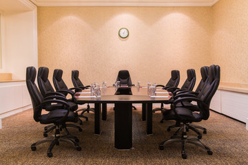 Conference room for business meetings large table in the middle of the room around comfortable...
