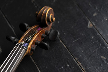 Fototapeta premium A part of a violin or a viola on a wood background