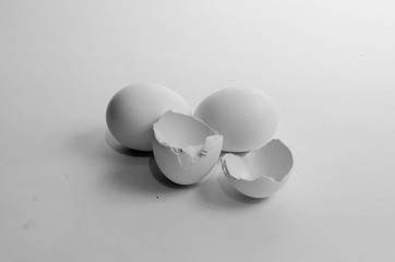 Three white eggs on a white isolated background