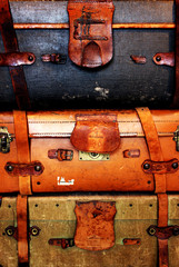 stack of old vintage suitcases