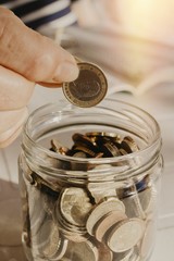 older woman saving money on the boat, pensions and savings