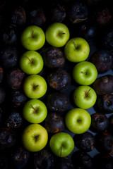 letters of the alphabet lined with green apples