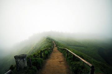 Mountain foggy landscape with hiking trail and view of beautiful lakes Ponta Delgada, Sao Miguel...