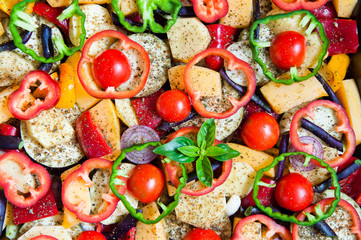 Fresh organic vegetables cut with rings prepared for baking in the oven