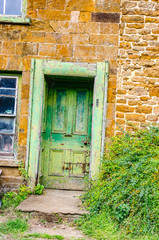 Fototapeta na wymiar Old green cottage door Oxfordshire