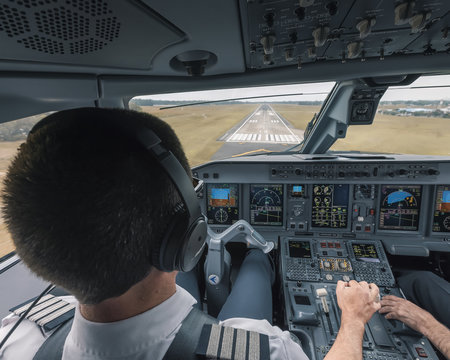 Pilot Landing Modern Passenger Aircraft