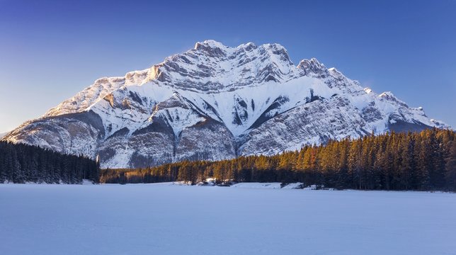 Winter Landscape of Johnston Lake with Snowy Cascade Mountain Peak in the Background. Banff National Park, Rocky Mountains, Alberta, Canada
