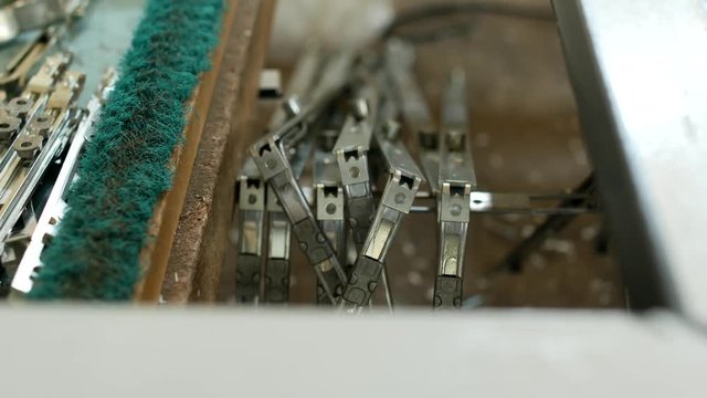 Production of pvc windows, on the table lie screws and curtains for PVC windows, manufacturing of frames and windows from plastic profiles, close-up