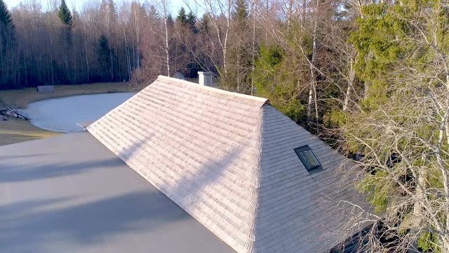 3257_The_wooden_shingles_roof_of_the_big_house_in_the_forest_area.mov