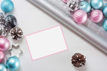 Pink and blue Christmas balls and wrapping paper for gifts with old photo frame