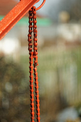 old red chain, rural view in the background