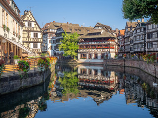 Fototapeta na wymiar View along the Ill River in Petite France areas of Strasbourg in the Alsace region of France. 