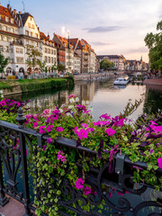 Fototapeta na wymiar View along the Ill River in historic areas of Strasbourg in the Alsace region of France. 