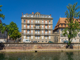 Fototapeta premium View along the Ill River in historic areas of Strasbourg in the Alsace region of France. 