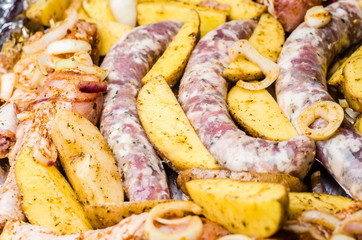 potatoes, slices of grilled sausages
