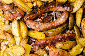 potatoes, slices of grilled sausages