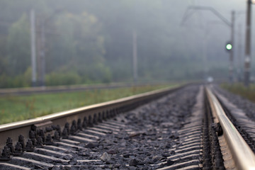 Rain drops broke on the rail. The photo symbolizes nostalgia and loneliness.