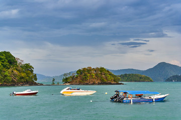 Fototapeta na wymiar Cenang Beach Water boat in Langkawi island, Malaysia
