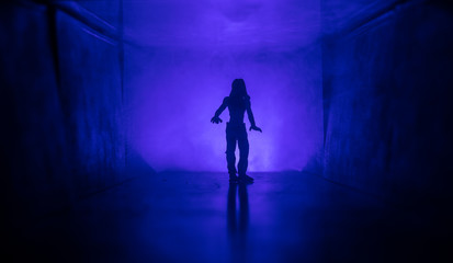 Creepy silhouette in the dark abandoned building. Horror about maniac concept or Dark corridor with cabinet doors and lights with silhouette of spooky horror person standing with different poses.