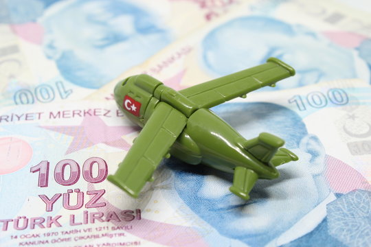 Toy Plane with Turkish Liras, military cargo plane, 100 Turkish lira, army related image, conscept photo, war economy