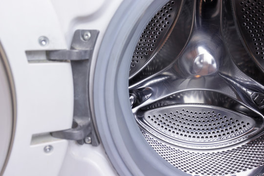Washing machine drum close up, laundry concept