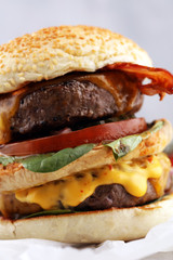 Tasty fresh meat burgers with salad and cheese. Homemade angus burger.