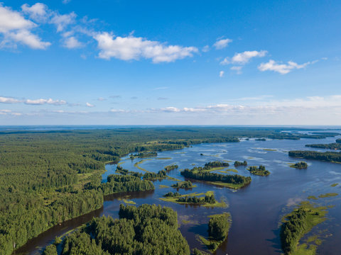 Aerial view of river Nemda with green riverside and islands. Summer 2018, Russia