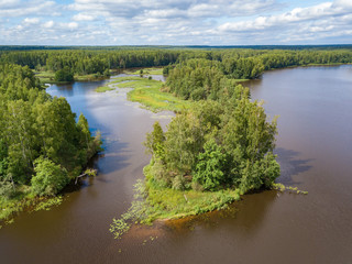Aerial view of river Nemda with green riverside and islands. Summer 2018, Russia