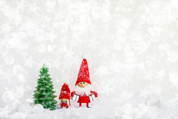 Santa claus gnome background with Christmas tree and snow. Copy space, holiday symbol.