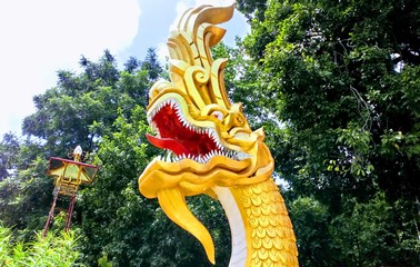 Naga Head Statue in Thai temple...Nature as background.