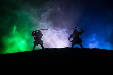Silhouette of two samurais in duel. Picture with two samurais and sunset sky © zef art