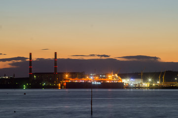 Fototapeta na wymiar Bulgarian industrial port at night with cranes