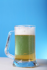 Beer mug against blue background