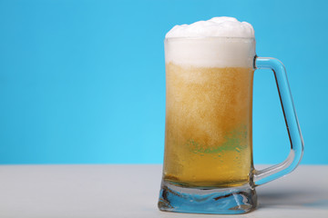 Beer mug against blue background