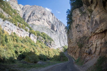 Cycling mountain road. Misty mountain road in high mountains.. Cloudy sky with mountain road. Summertime
