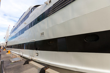 Large yacht tied to the dock on the shore of Lake Michigan