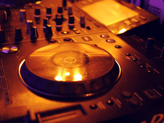 Sound mixing console detail, close up. DJ professional music console. Wide angle photo of black...