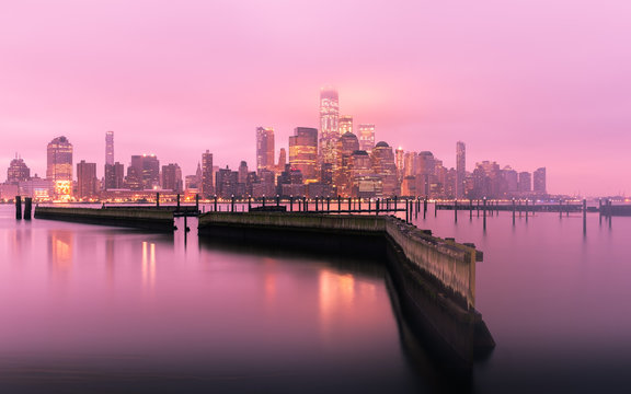 Manhattan Skyline before sunrise with fog, New York City, USA