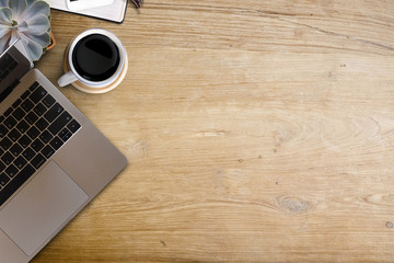 Office wooden desk laptop and supplies. Workspace and copy space