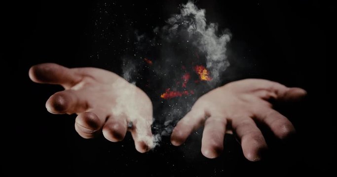 Magic trick with fire and smoke out of magician hands
