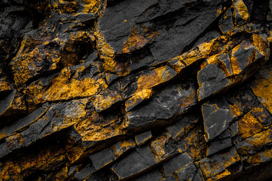 black rock background with gold  / yellow colored rocks
