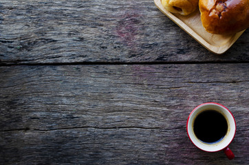 Espresso coffee and Tasty buns on wooden background above, Copy space place for your text