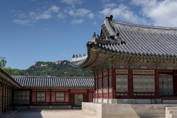 The Korea traditional architecture have a beauty of both colorful and curve under blue and high sky in autumn. Here is Gyeongbokgung Palace where is one of the famous places to tourist who visit Korea