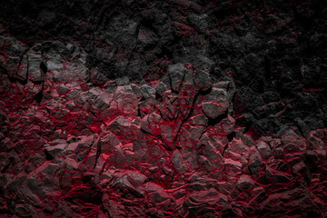 roches de couleur noire et rouge / fond de mur de roche