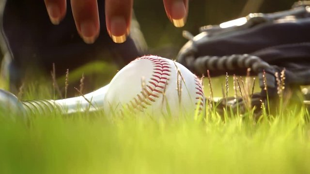 Equipment for the sport of baseball laying on the lawn