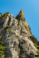 stunning rock formation at the peaks under the blue sky on a sunny day