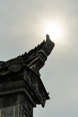 Hui style Chinese building rooftop decoration under the sun