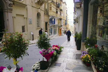 Walkers on narrow streets of Valletta
