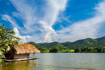 The wooden raft in the water reservoirs and mountain views.