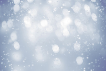 Beautiful Christmas  background with snowflakes and   glittering bokeh stars. Abstract  Glowing...